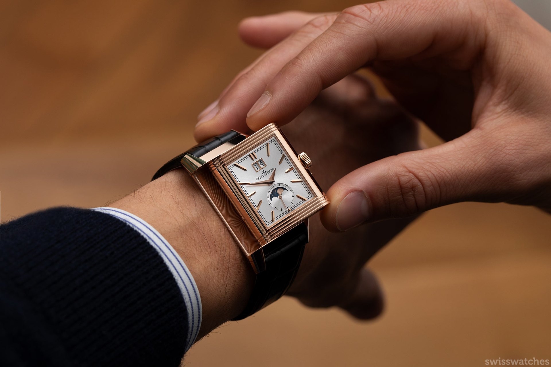 A curated trio of luxury watches with collector accessories